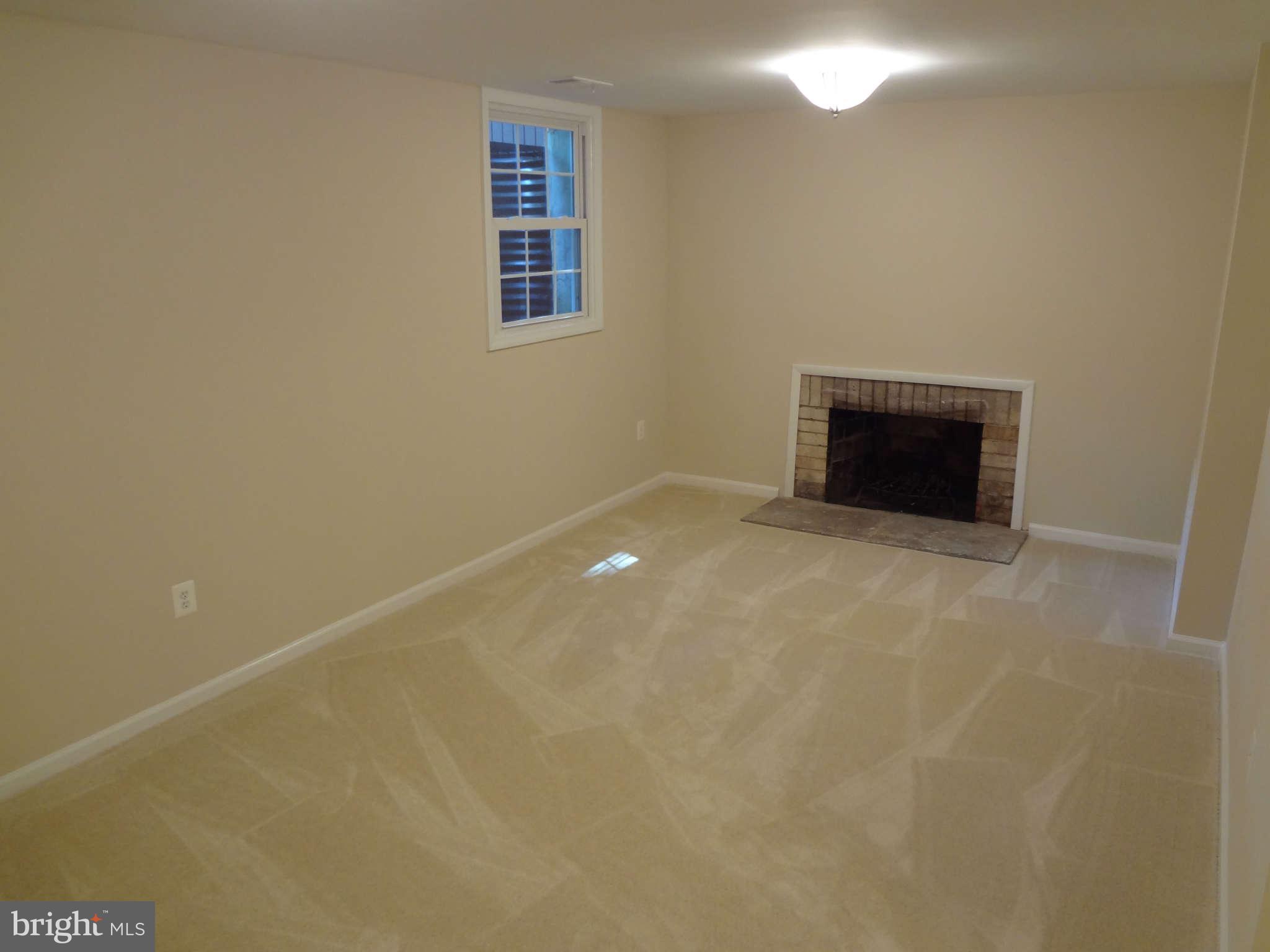 6354 Draco Street Burke, VA 22015 - Photo 9 of 21 a view of an empty room with a window