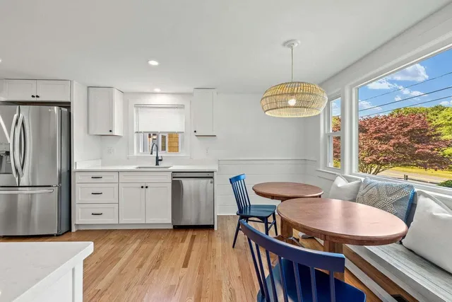 a kitchen with a stove top oven sink and refrigerator