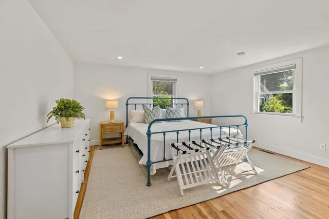 a bedroom with a bed and a table