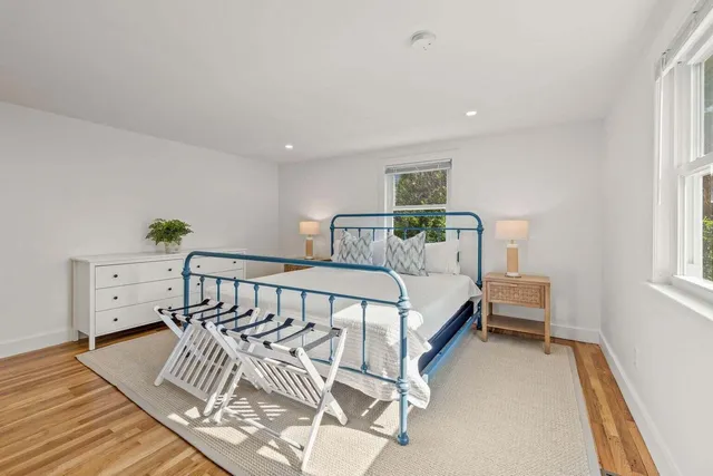 a bathroom with a sink a mirror and a window