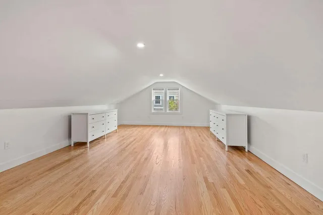 a view of empty room with wooden walls