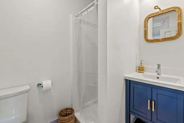 a bed room with furniture and a flat screen tv