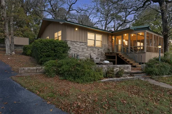 a front view of a house with garden