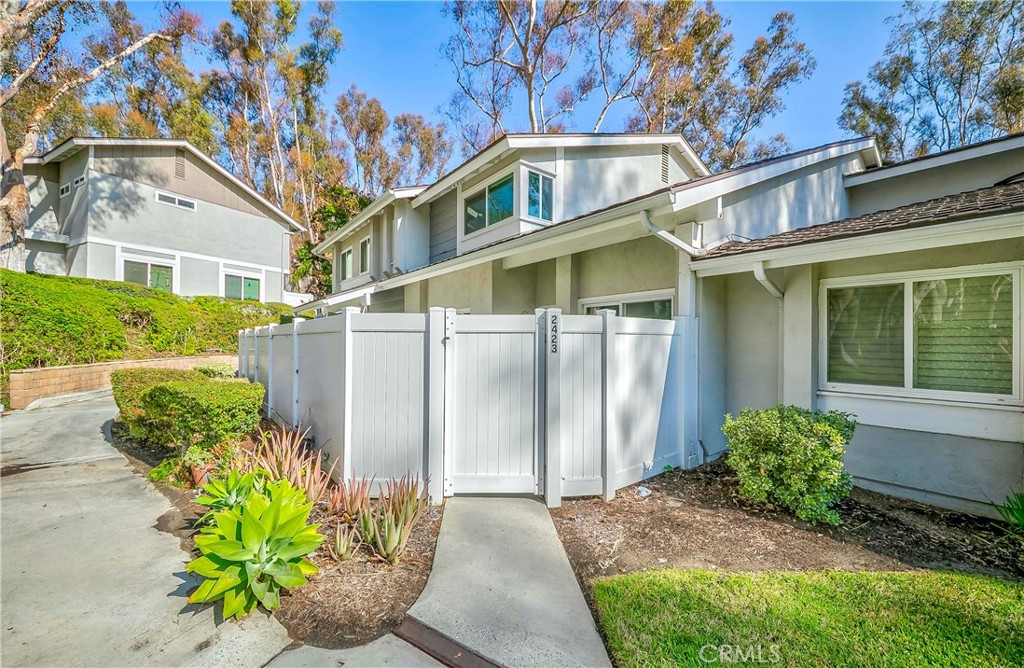 2423 Coventry Circle Fullerton, CA 92833 - Photo 1 of 1 a front view of a house with a yard
