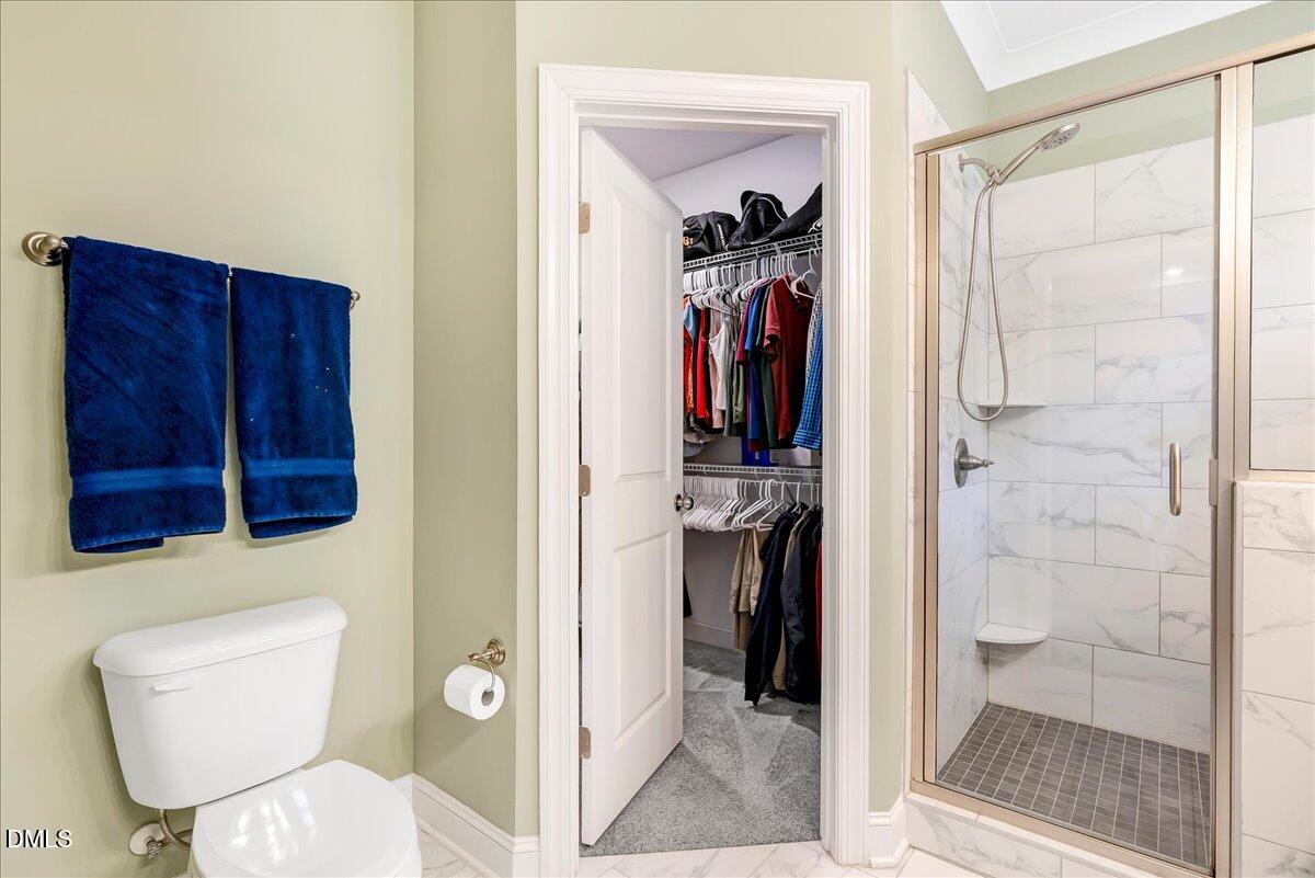 1208 Montgomery Road Franklinton, NC 27525 - Photo 18 of 61 a bathroom with a toilet and a shower