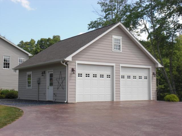 1063 Madcap Road Rocky Mount, VA 24151 - Photo 3 of 39 a view of a house with garage and yard