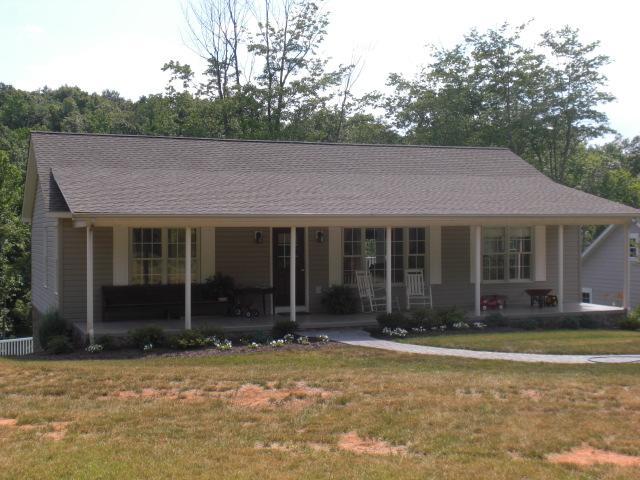 1063 Madcap Road Rocky Mount, VA 24151 - Photo 38 of 39 a front view of a house with a garden
