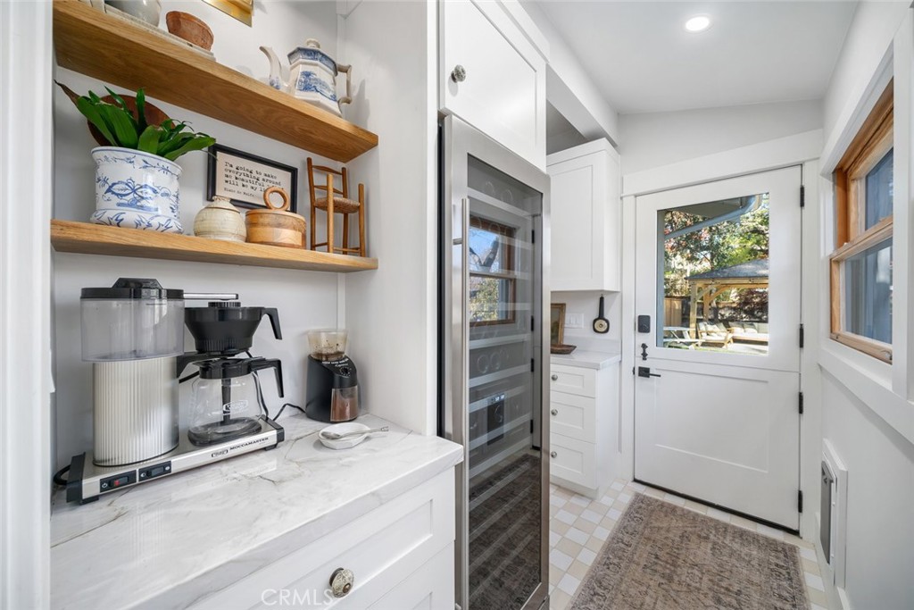 135 18th Street Paso Robles, CA 93446 - Photo 12 of 45 a kitchen with stainless steel appliances granite countertop a refrigerator and a stove top oven
