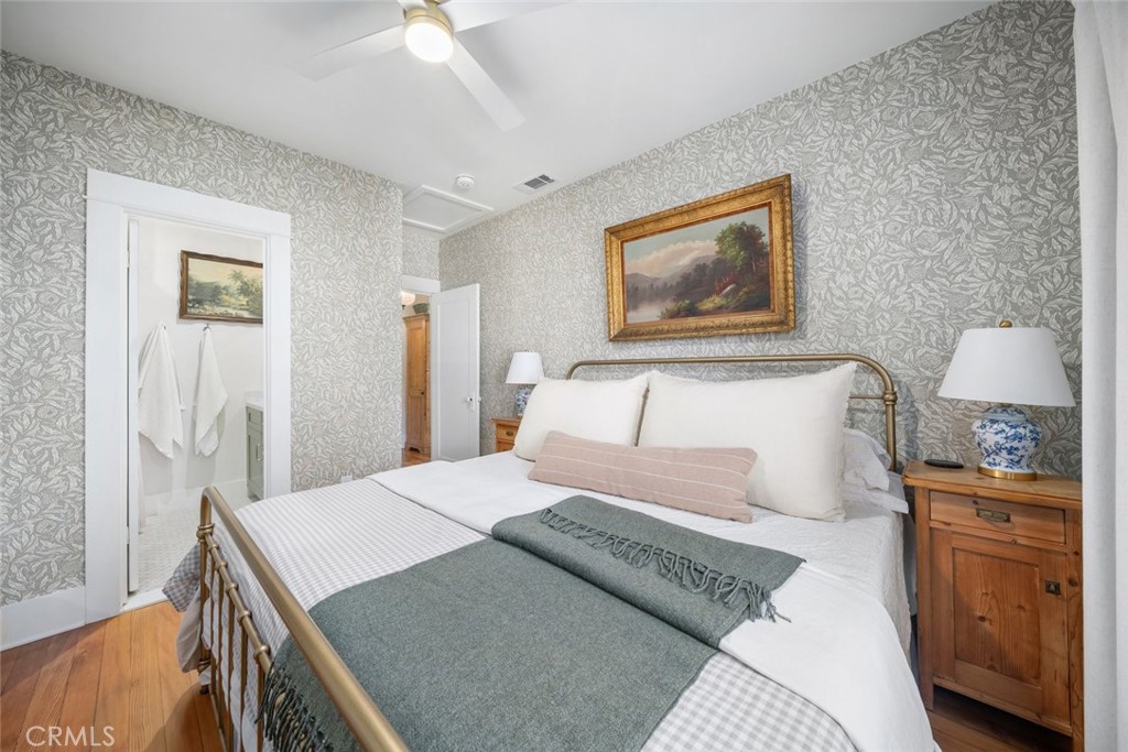 135 18th Street Paso Robles, CA 93446 - Photo 16 of 45 a bedroom with a bed and a lamp on dresser