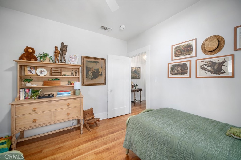 135 18th Street Paso Robles, CA 93446 - Photo 20 of 45 a bedroom with furniture and wooden floor