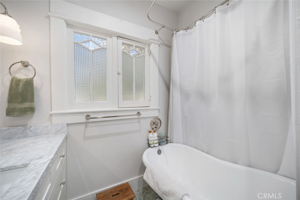 135 18th Street Paso Robles, CA 93446 - Photo 22 of 45 a bathroom with a sink a toilet and a mirror