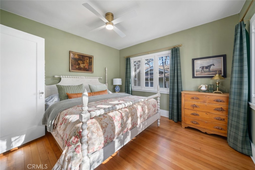 135 18th Street Paso Robles, CA 93446 - Photo 23 of 45 a bedroom with bed and paintings on the wall
