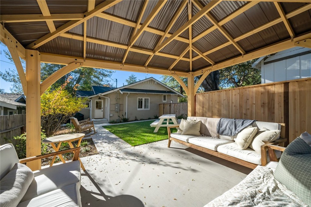 135 18th Street Paso Robles, CA 93446 - Photo 29 of 45 a view of a backyard with couches table and chairs with wooden floor