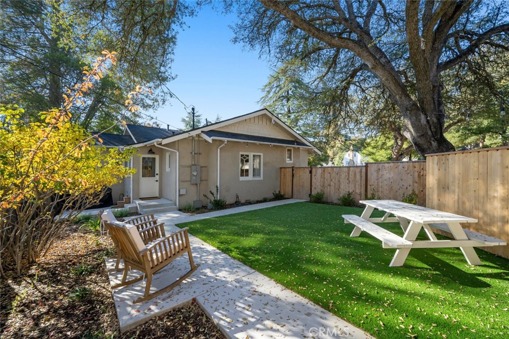 135 18th Street Paso Robles, CA 93446 - Photo 30 of 45 a view of a chair and fire pit in the backyard of the house