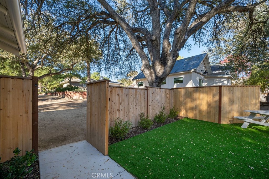 135 18th Street Paso Robles, CA 93446 - Photo 31 of 45 a view of a backyard with large tree
