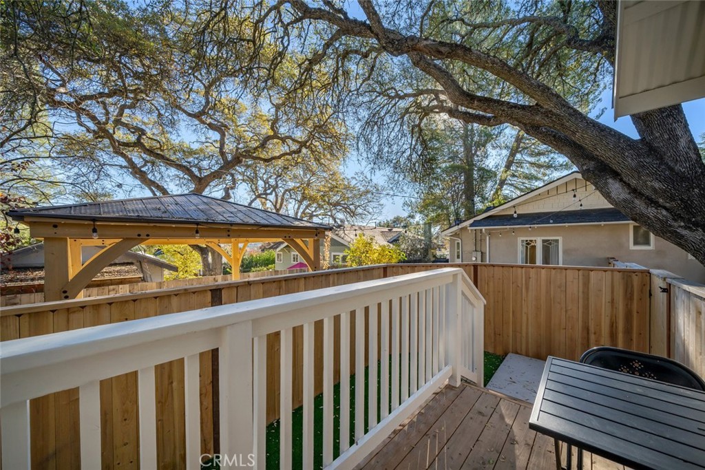 135 18th Street Paso Robles, CA 93446 - Photo 40 of 45 a view of a wooden deck and a yard with large tree