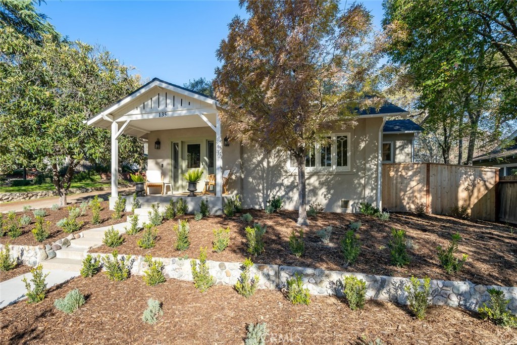 135 18th Street Paso Robles, CA 93446 - Photo 45 of 45 a view of a house with large windows and a tree