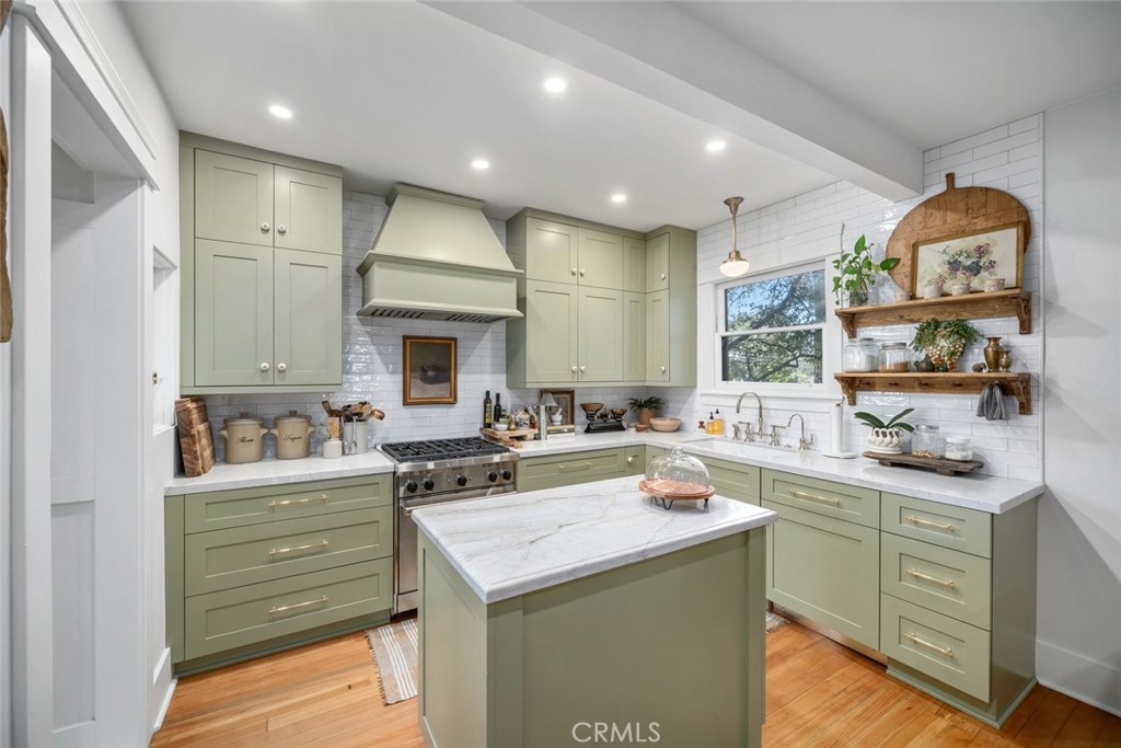 135 18th Street Paso Robles, CA 93446 - Photo 8 of 45 a kitchen with a sink stove and cabinets