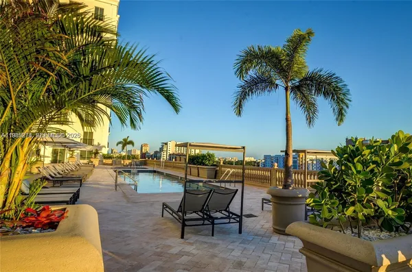 a view of balcony with two chairs and wooden floor