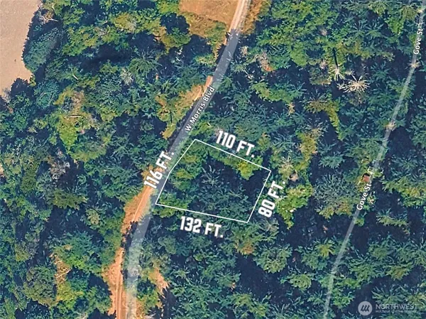 a backyard of a house with lots of green space and shower