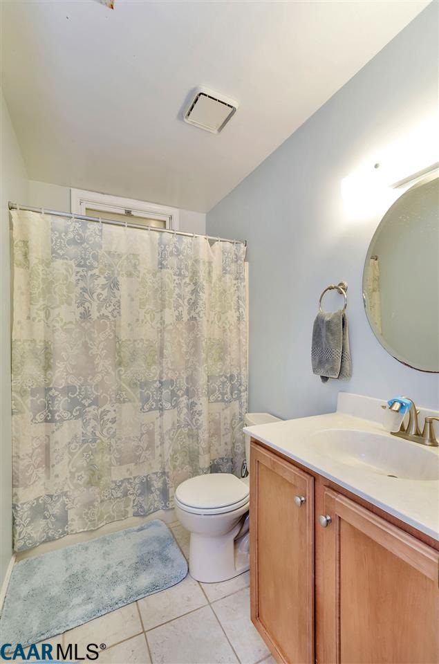 806 Harris Road Charlottesville, VA 22902 - Photo 11 of 20 a bathroom with a sink a toilet and shower