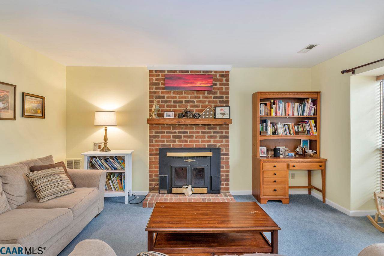 806 Harris Road Charlottesville, VA 22902 - Photo 5 of 20 a living room with furniture and a fireplace