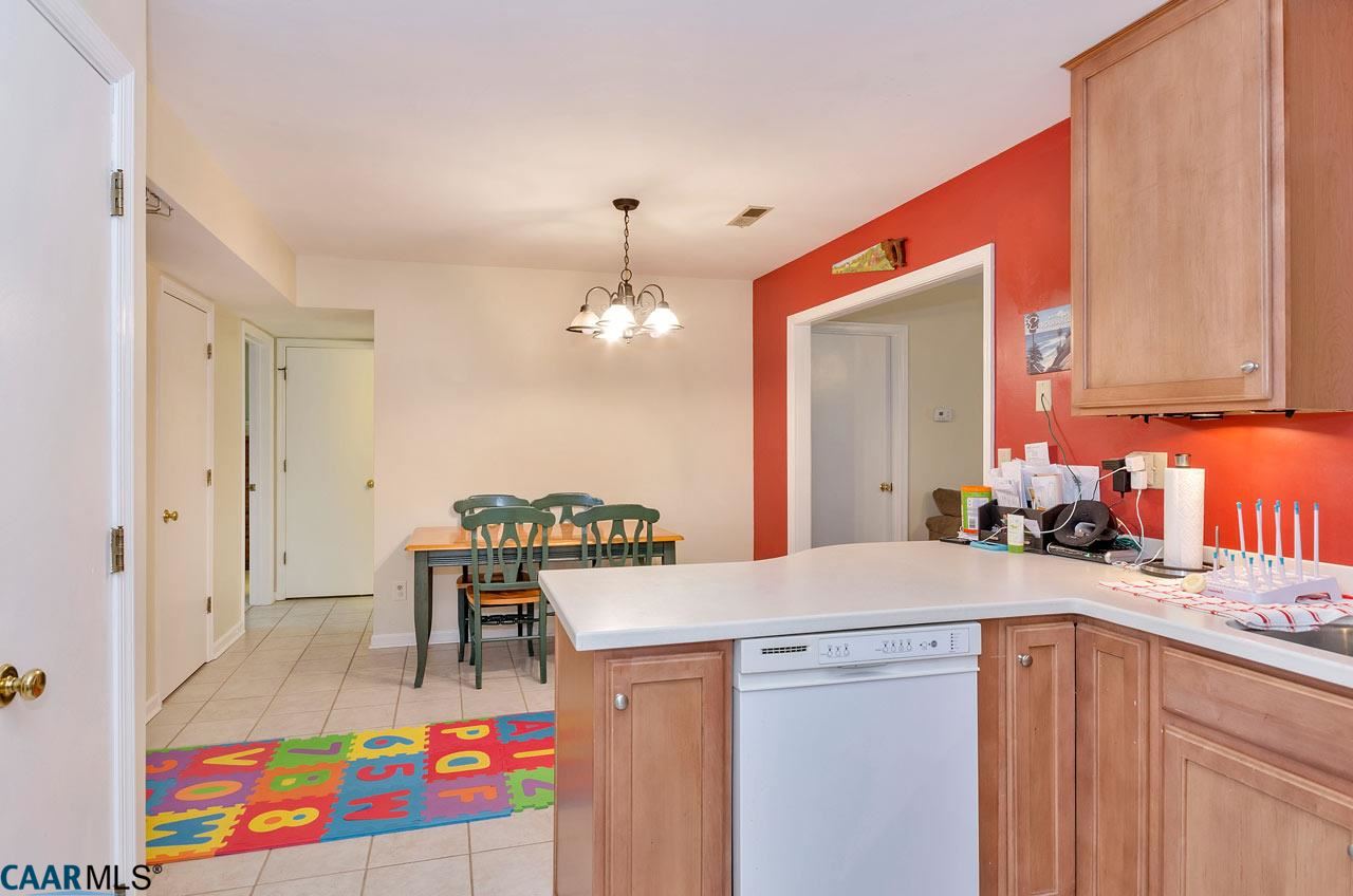 806 Harris Road Charlottesville, VA 22902 - Photo 6 of 20 a view of a kitchen area with furniture and chandelier