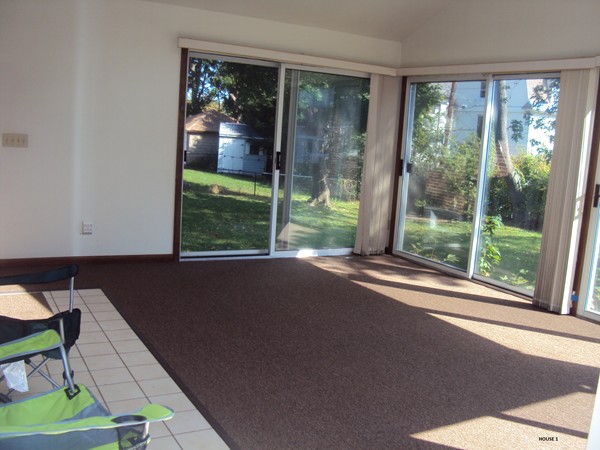 8 Rosemont Road Worcester, MA 01605 - Photo 18 of 30 a living room with a floor to ceiling window and wooden floor
