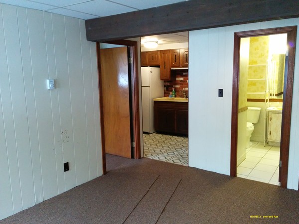 8 Rosemont Road Worcester, MA 01605 - Photo 27 of 30 a view of a hallway with wooden floor and a living room