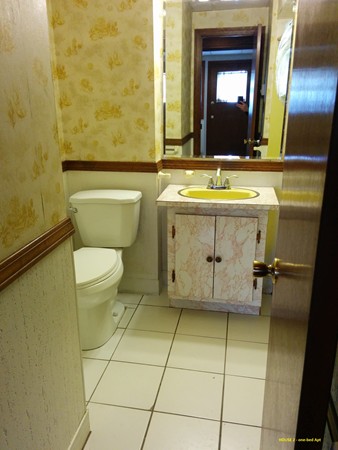 8 Rosemont Road Worcester, MA 01605 - Photo 29 of 30 a bathroom with a granite countertop toilet sink and mirror
