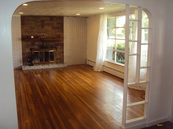 8 Rosemont Road Worcester, MA 01605 - Photo 9 of 30 a view of a livingroom with wooden floor and a fireplace