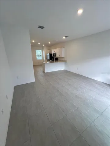 a view of a kitchen and a window