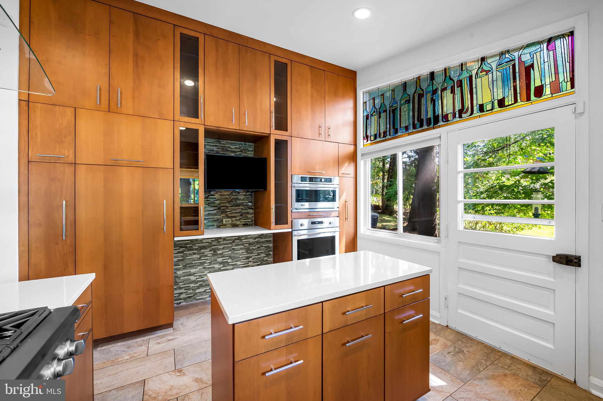 6103 Ivydene Terrace Baltimore, MD 21209 - Photo 14 of 51 a kitchen with stainless steel appliances granite countertop a refrigerator and a cabinets