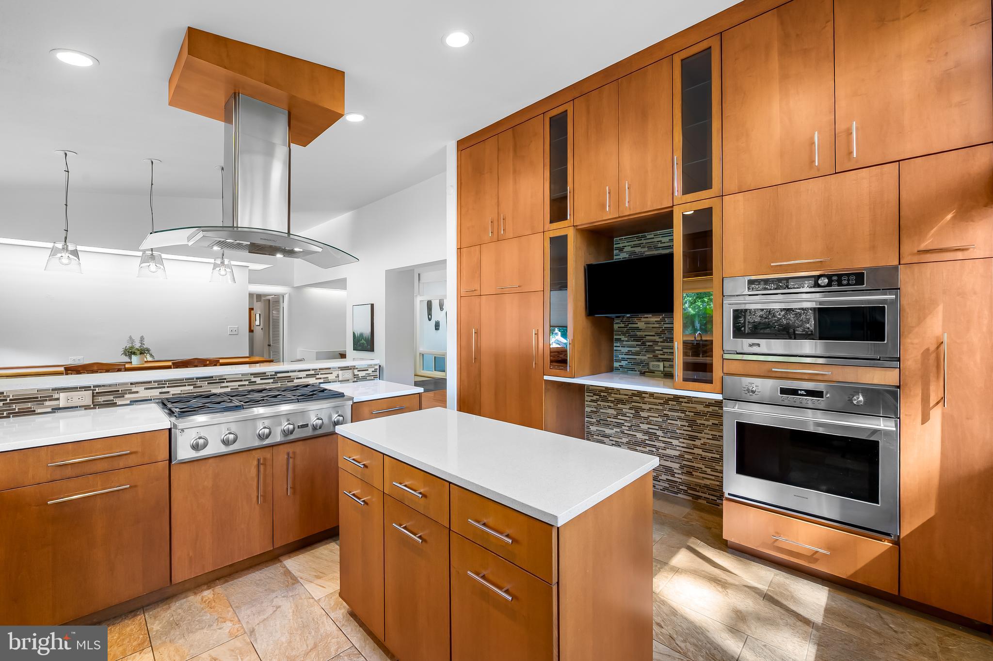6103 Ivydene Terrace Baltimore, MD 21209 - Photo 15 of 51 a kitchen with stainless steel appliances granite countertop a stove a sink and a microwave