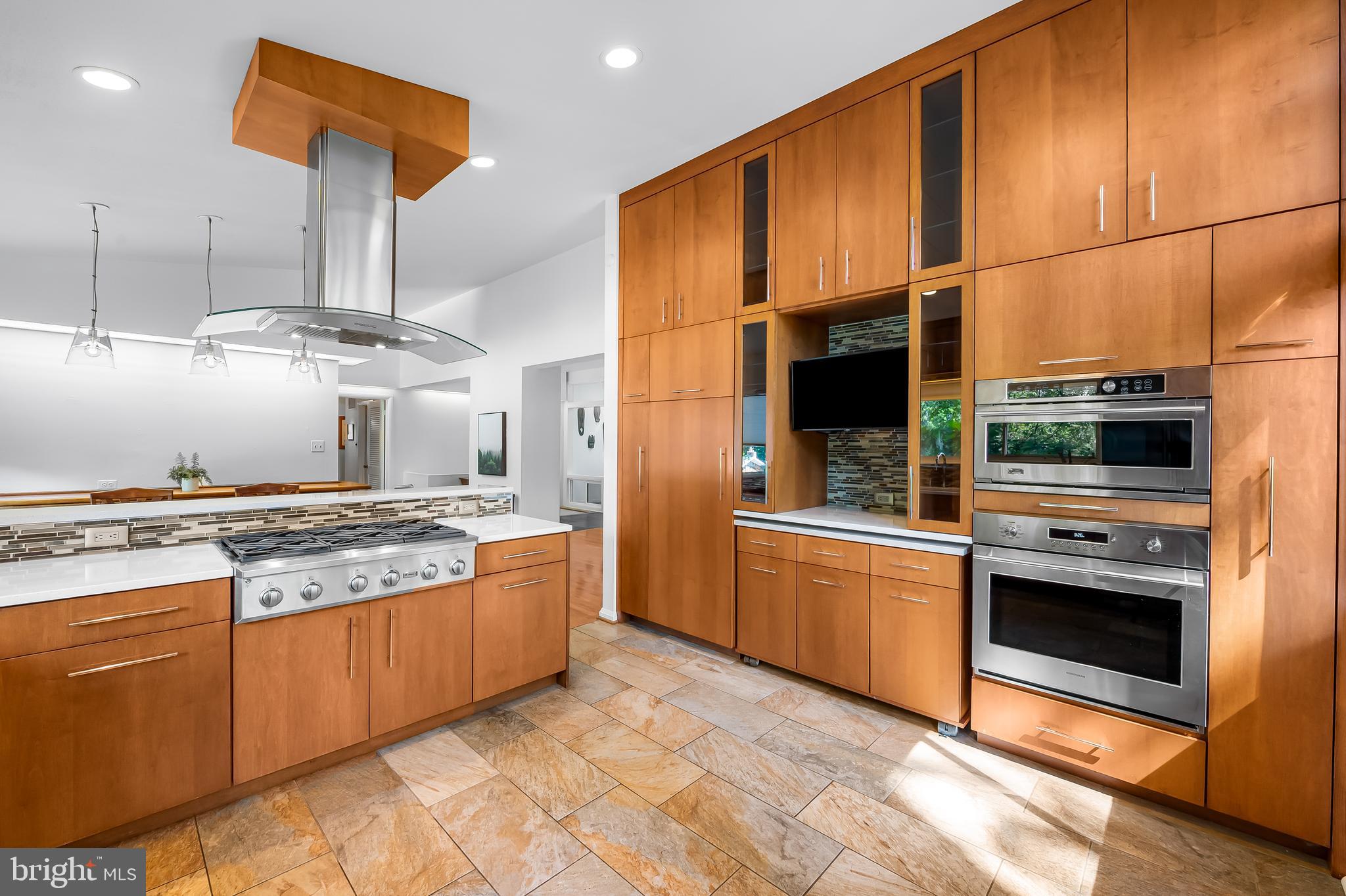 6103 Ivydene Terrace Baltimore, MD 21209 - Photo 16 of 51 a kitchen with stainless steel appliances granite countertop a stove a sink and a refrigerator