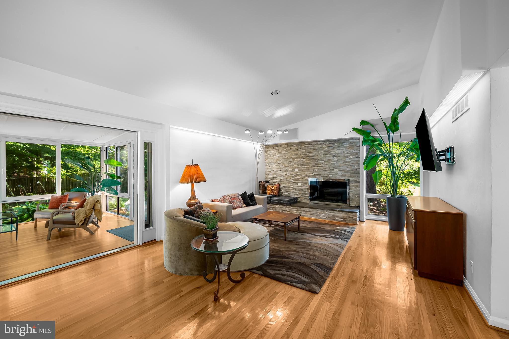 6103 Ivydene Terrace Baltimore, MD 21209 - Photo 17 of 51 a living room with furniture fireplace and wooden floor
