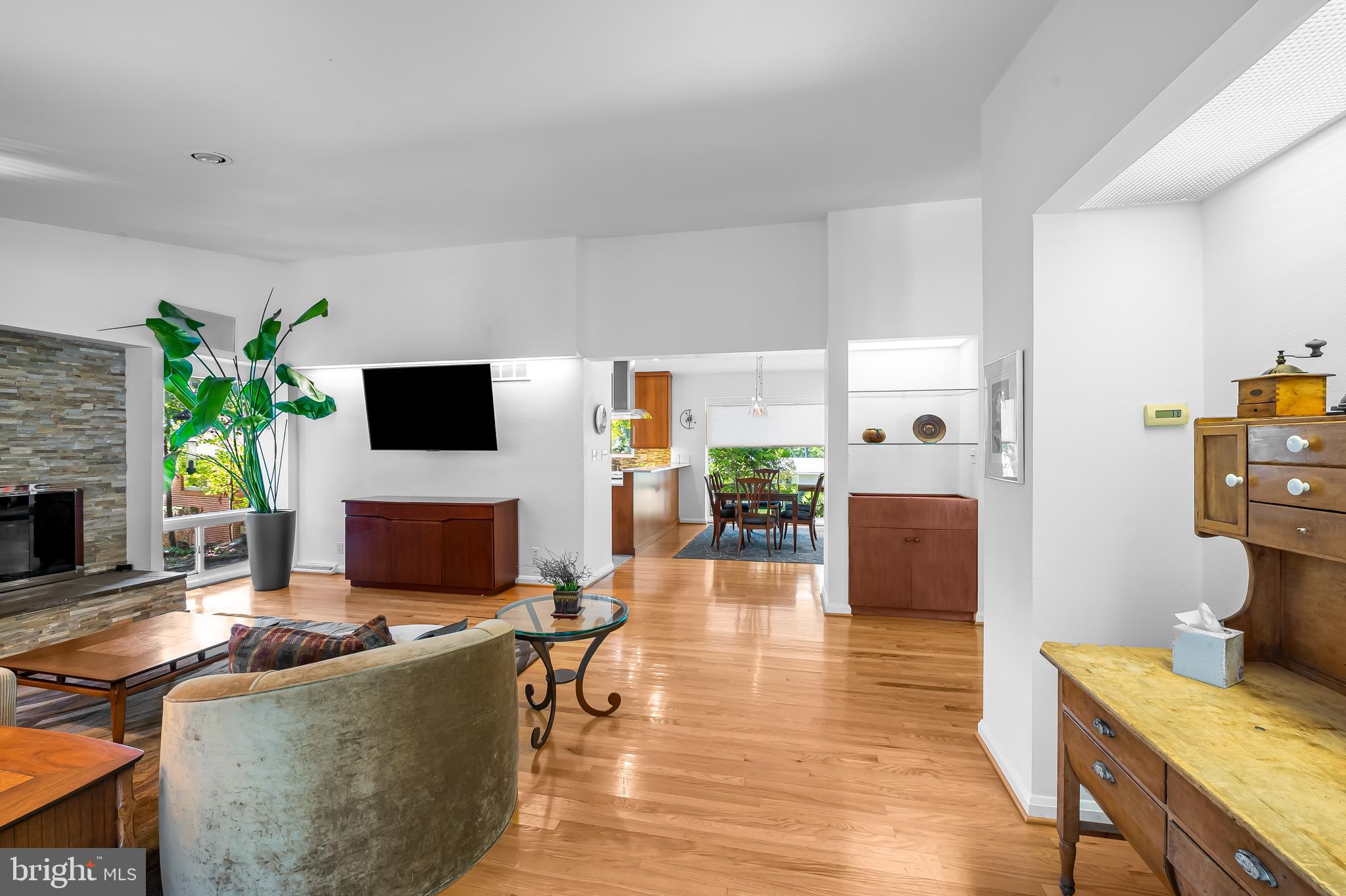 6103 Ivydene Terrace Baltimore, MD 21209 - Photo 18 of 51 a living room with furniture a flat screen tv and a fireplace