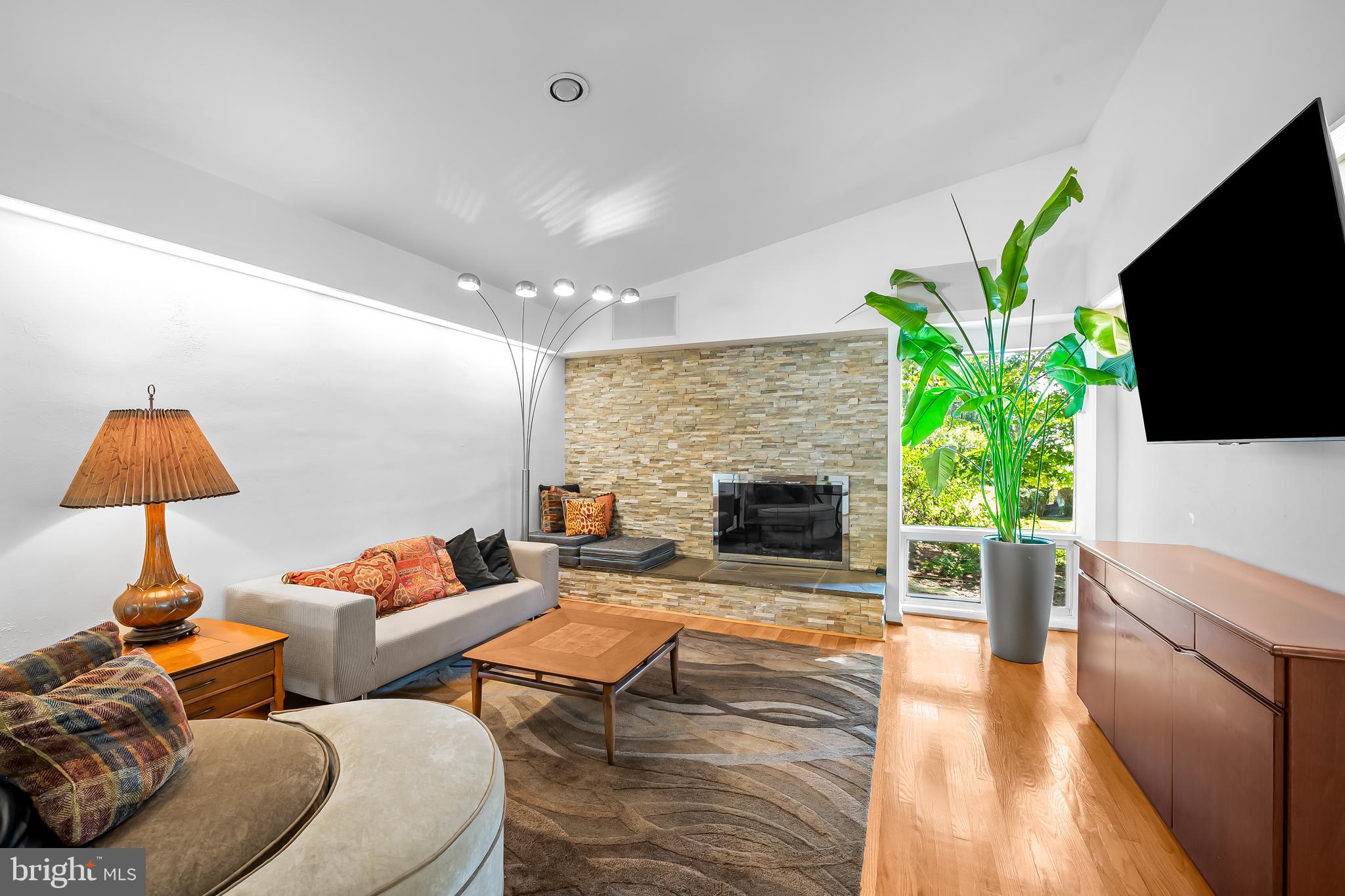 6103 Ivydene Terrace Baltimore, MD 21209 - Photo 19 of 51 a living room with furniture and a flat screen tv