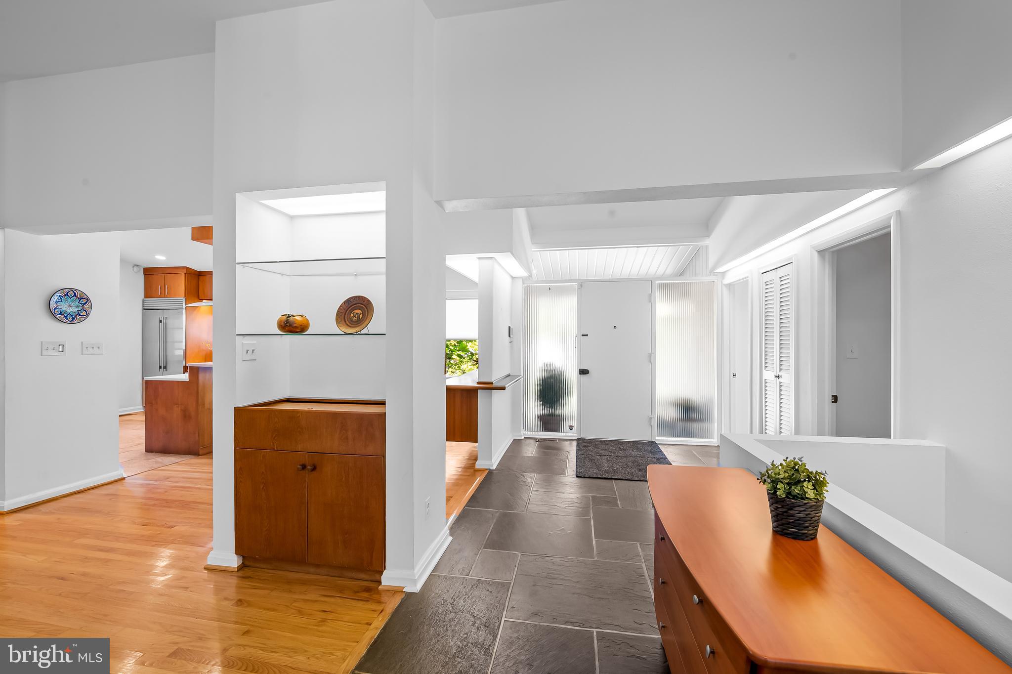 6103 Ivydene Terrace Baltimore, MD 21209 - Photo 2 of 51 a living room with furniture and a table