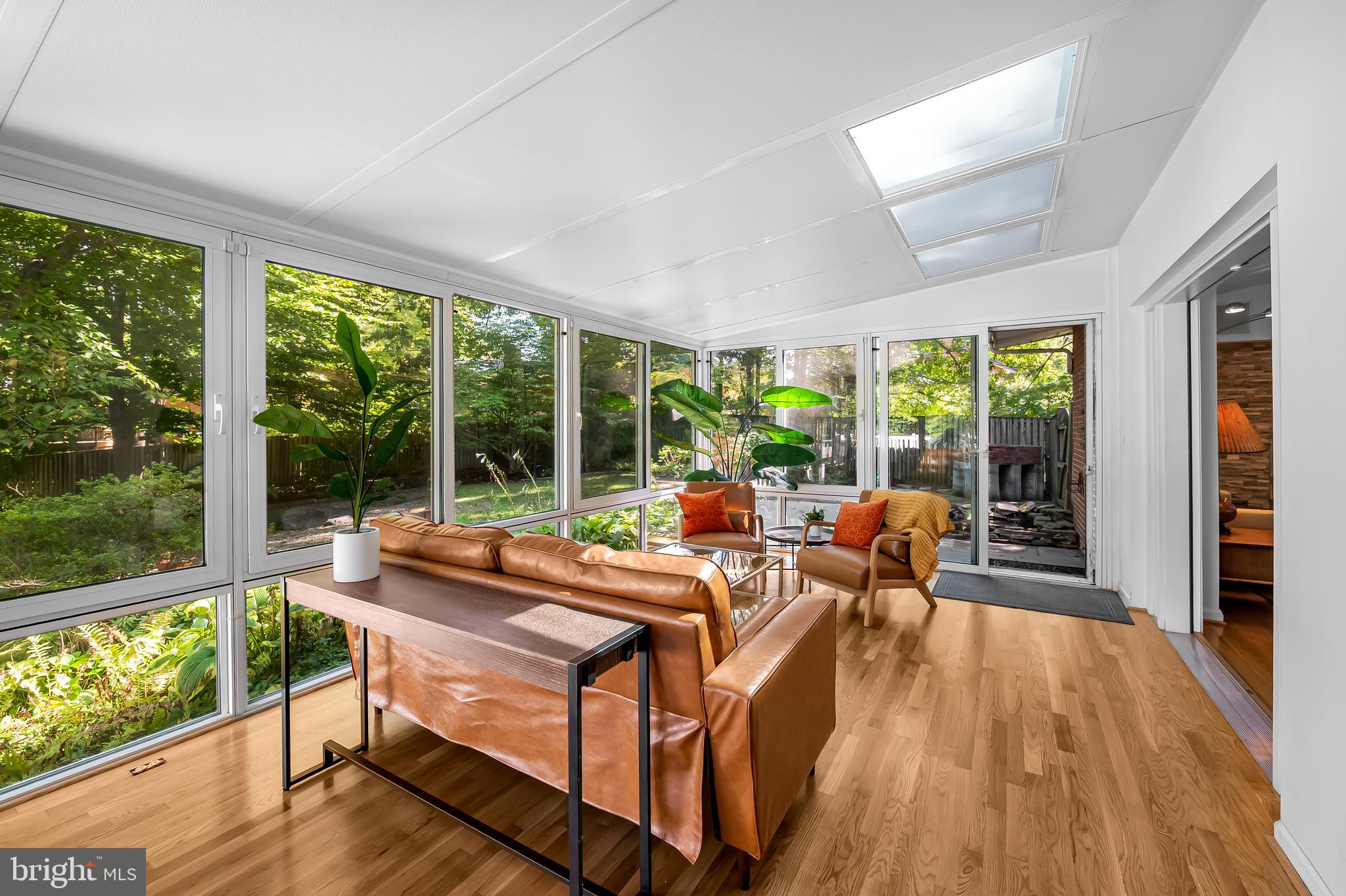 6103 Ivydene Terrace Baltimore, MD 21209 - Photo 22 of 51 a living room with furniture and a large window