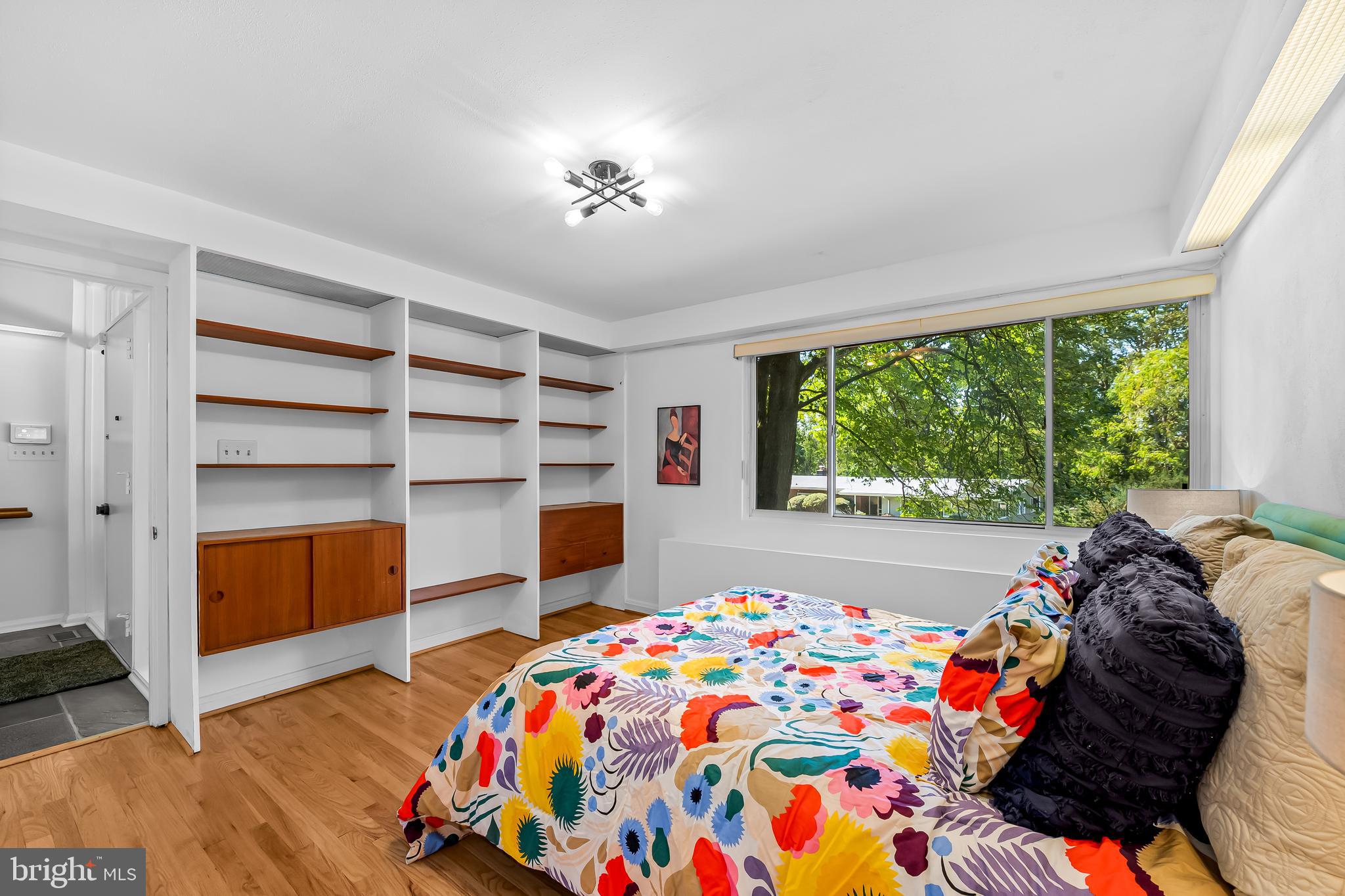 6103 Ivydene Terrace Baltimore, MD 21209 - Photo 25 of 51 a very nice looking bedroom with a bed and a bookshelf