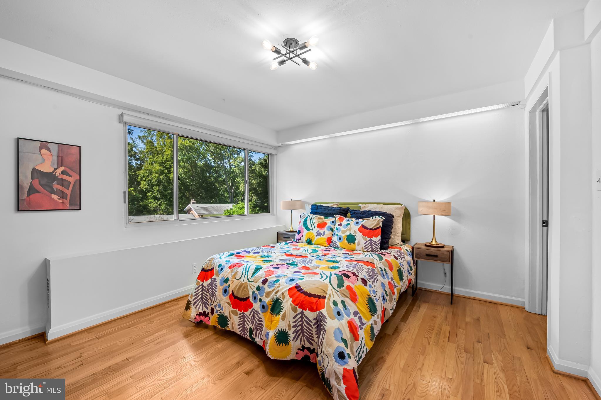 6103 Ivydene Terrace Baltimore, MD 21209 - Photo 26 of 51 a bedroom with a bed and a window