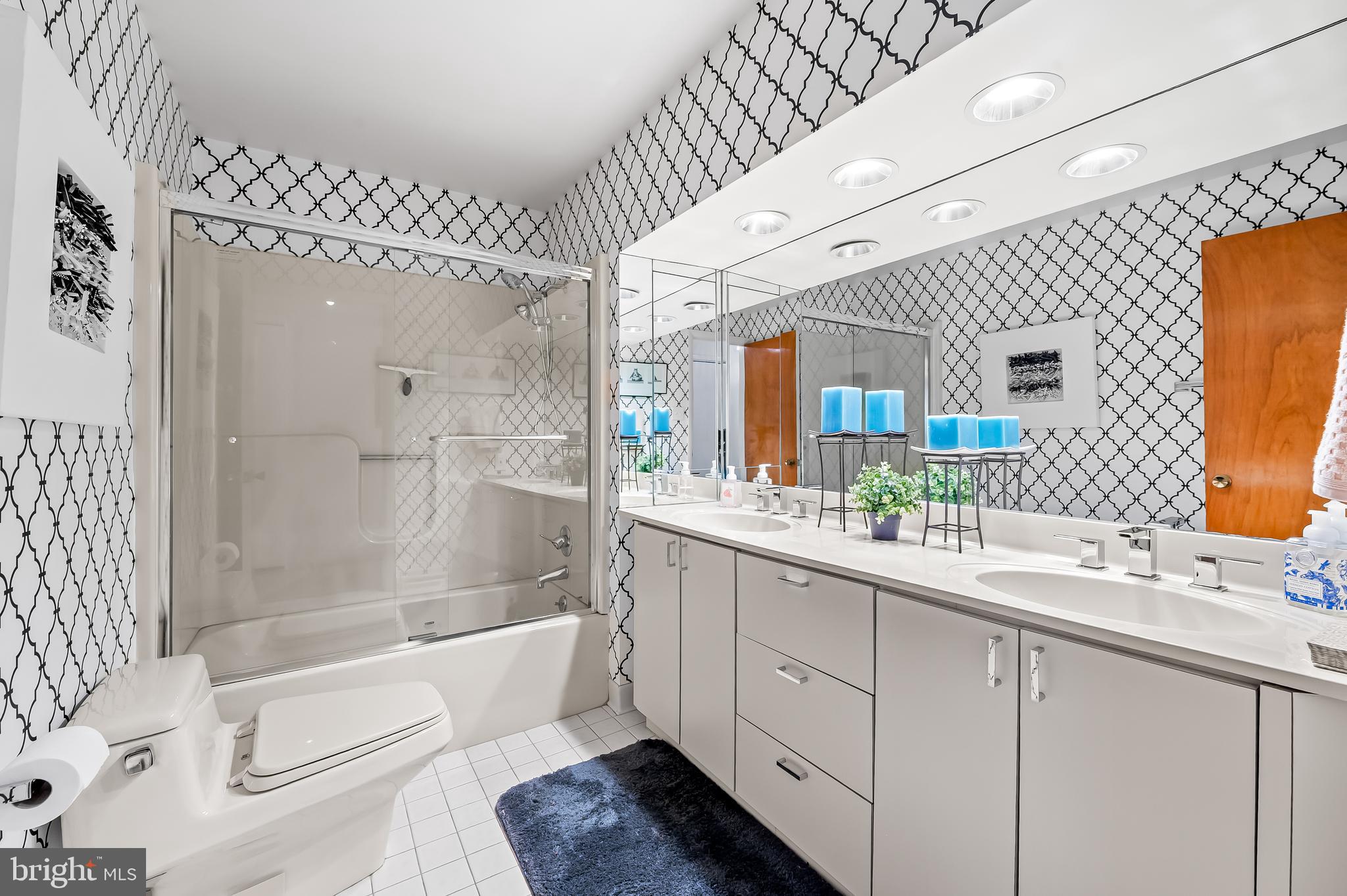 6103 Ivydene Terrace Baltimore, MD 21209 - Photo 30 of 51 a bathroom with a granite countertop sink mirror and bathtub