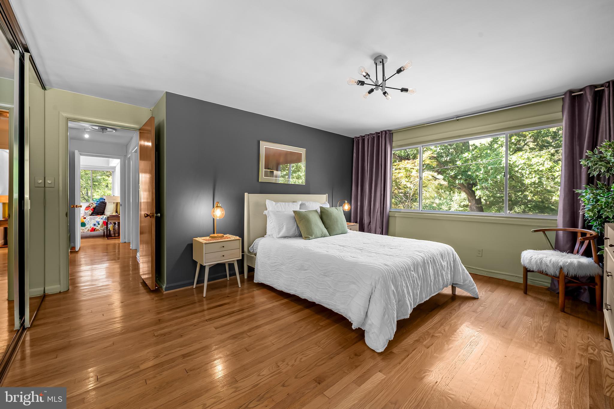 6103 Ivydene Terrace Baltimore, MD 21209 - Photo 31 of 51 a bedroom with a bed and a large window