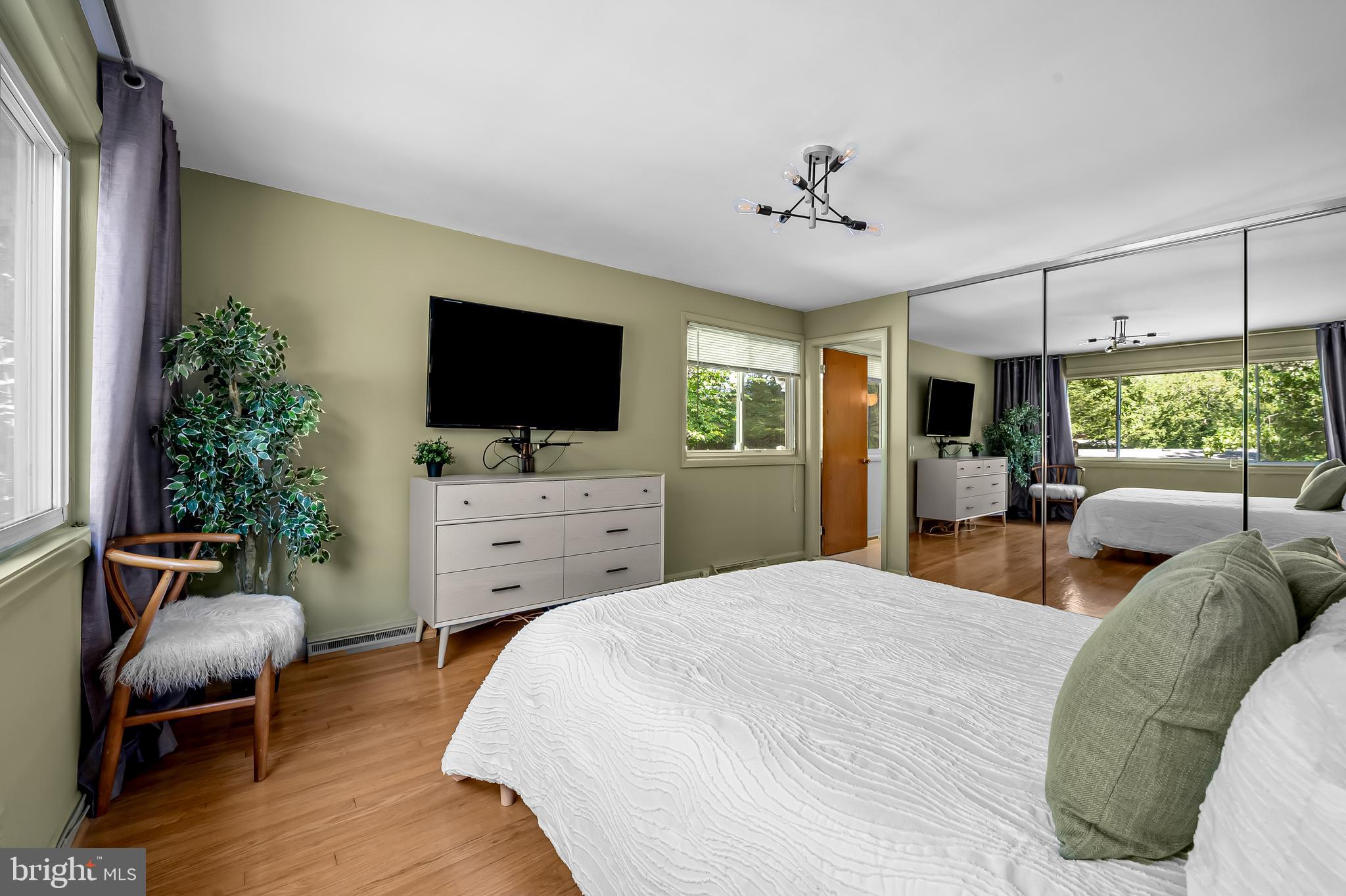 6103 Ivydene Terrace Baltimore, MD 21209 - Photo 33 of 51 a bedroom with furniture and a flat screen tv