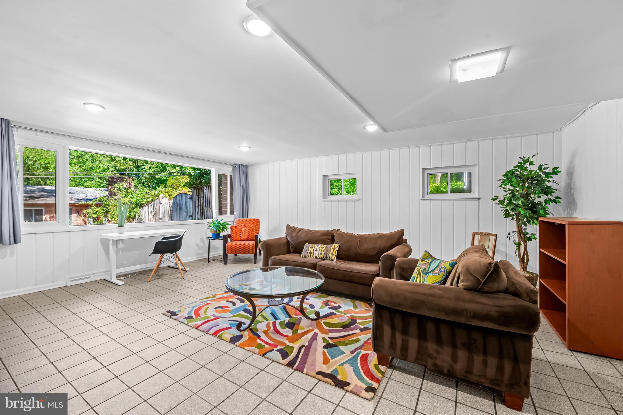 6103 Ivydene Terrace Baltimore, MD 21209 - Photo 35 of 51 a living room with furniture and a large window