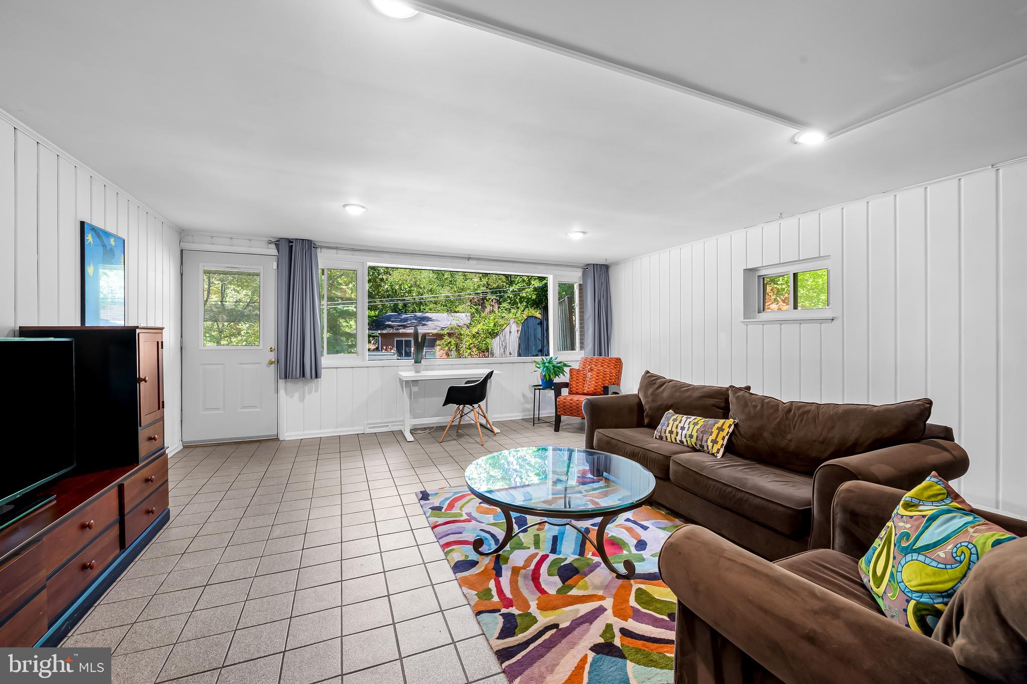 6103 Ivydene Terrace Baltimore, MD 21209 - Photo 37 of 51 a living room with furniture and a flat screen tv