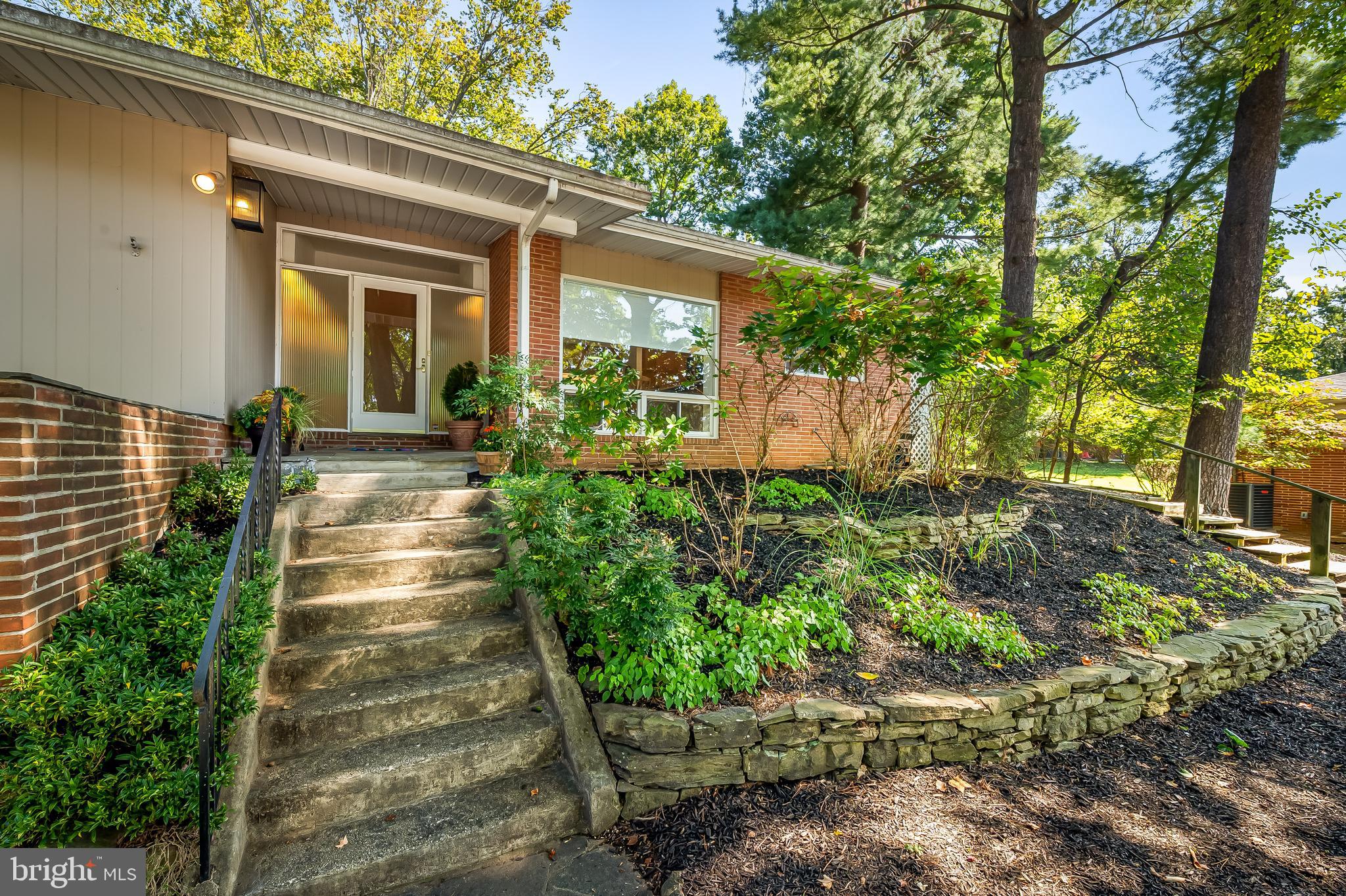 6103 Ivydene Terrace Baltimore, MD 21209 - Photo 51 of 51 a front view of a house with a yard