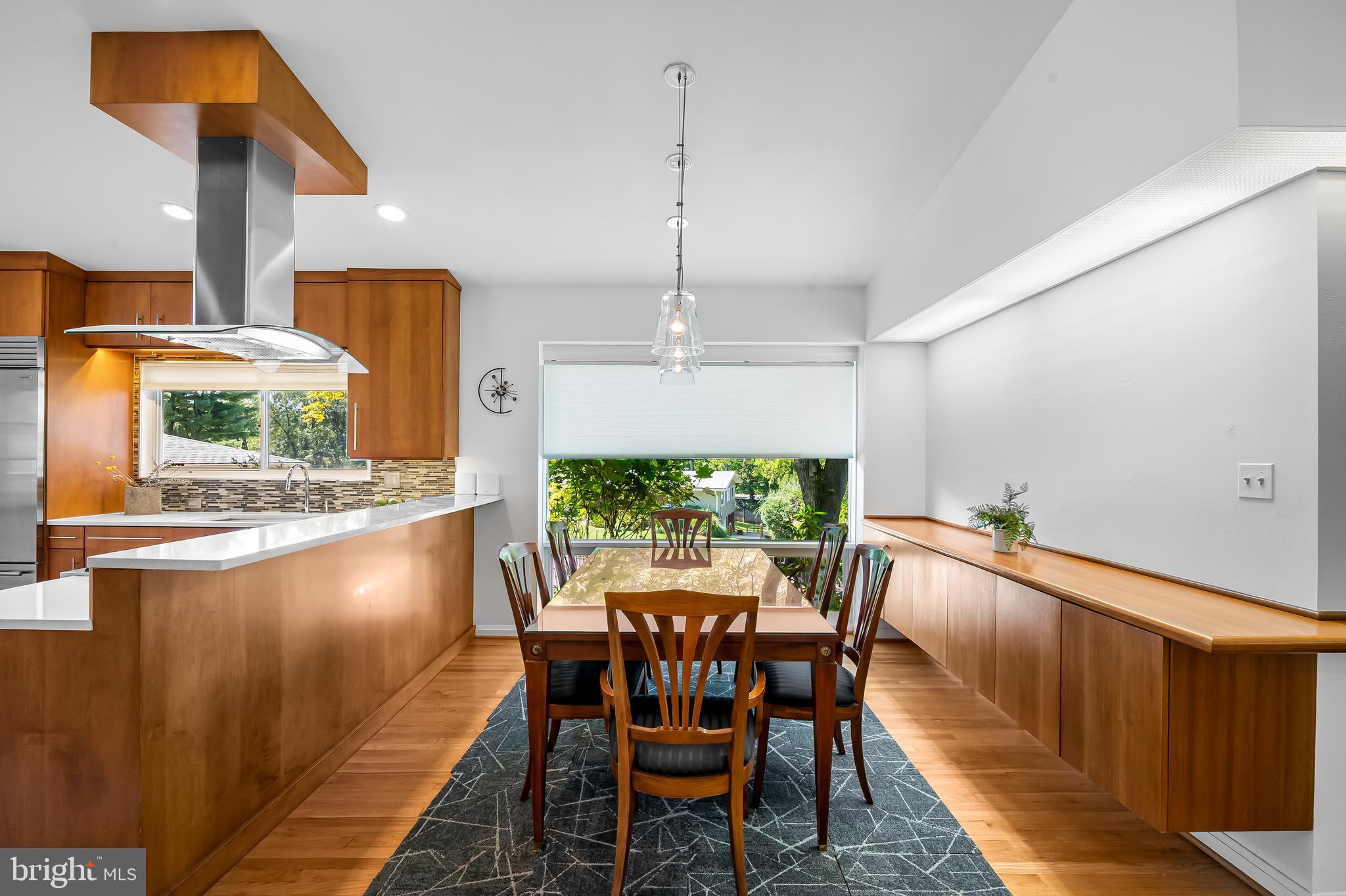 6103 Ivydene Terrace Baltimore, MD 21209 - Photo 7 of 51 a dining room with furniture and a floor to ceiling window