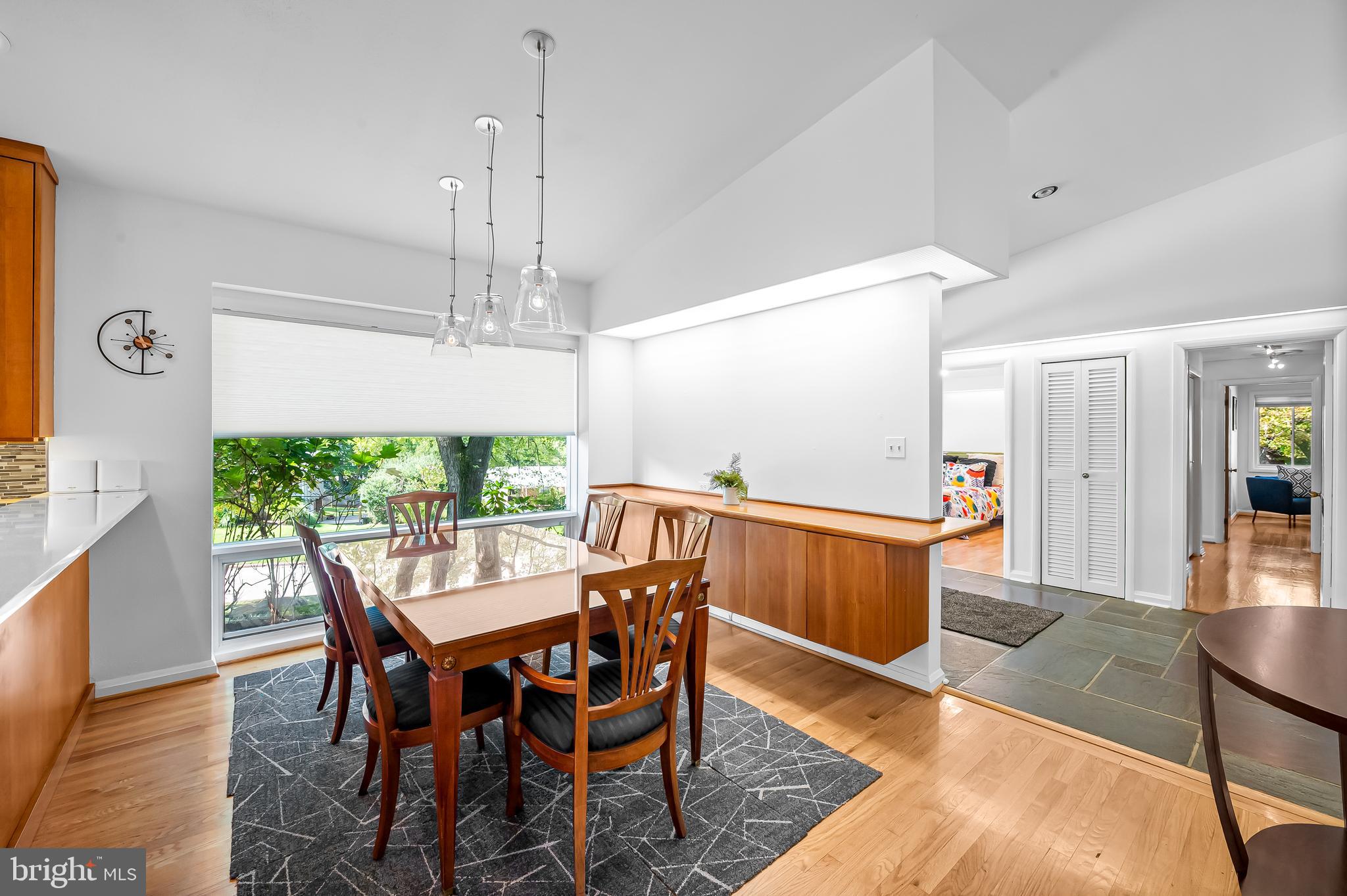 6103 Ivydene Terrace Baltimore, MD 21209 - Photo 8 of 51 a dining room with furniture a chandelier and wooden floor